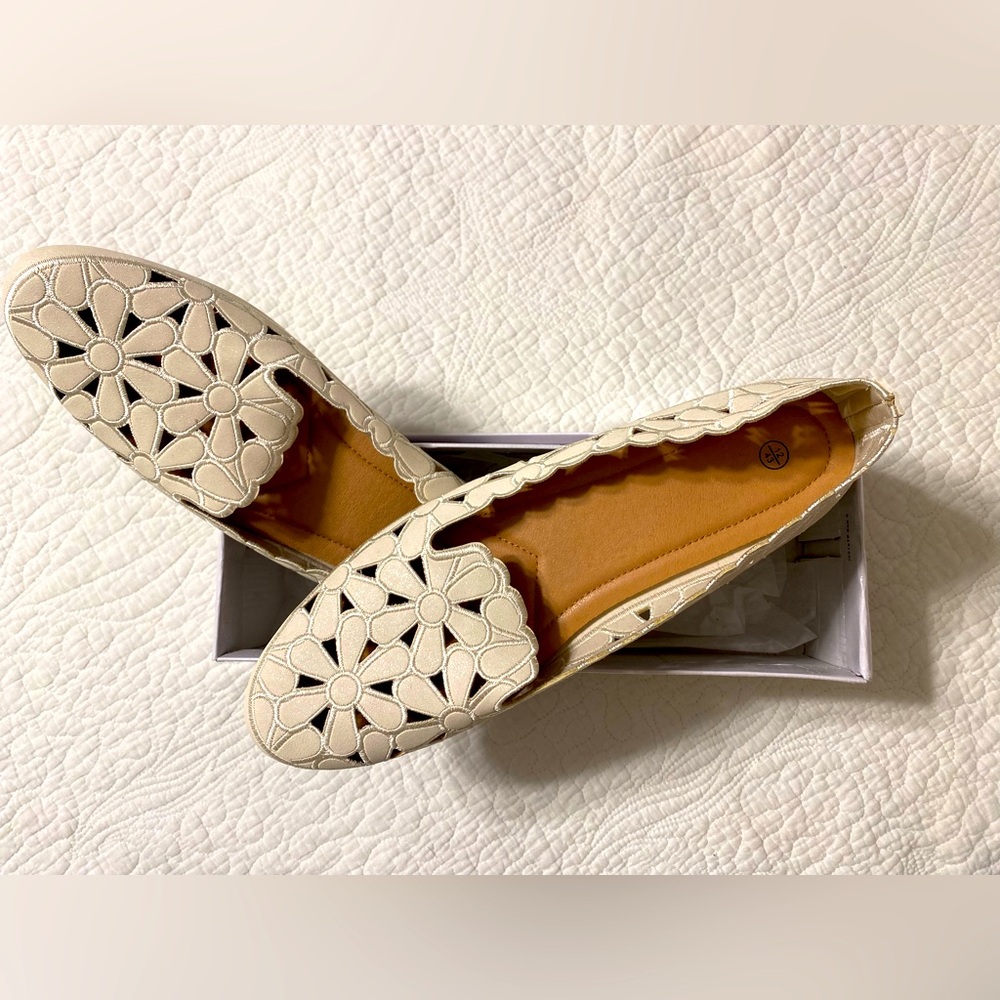 Women’s slip on shoes, size 12. New and never worn.